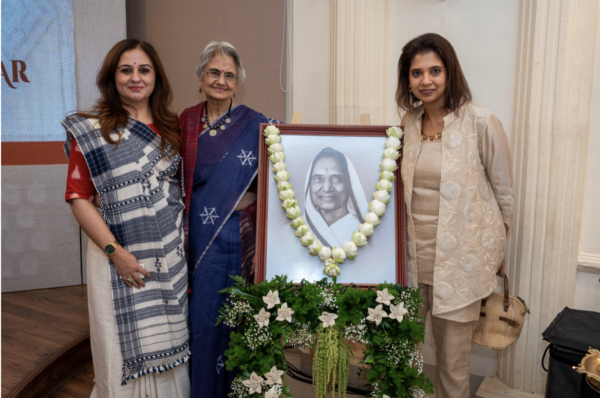 (L-R) Mrs. Nikkitaa Navlekar, Mrs. Kiran Bajaj, and Mrs. Pooja Bajaj with Jankidevi Ji’s Portrait
